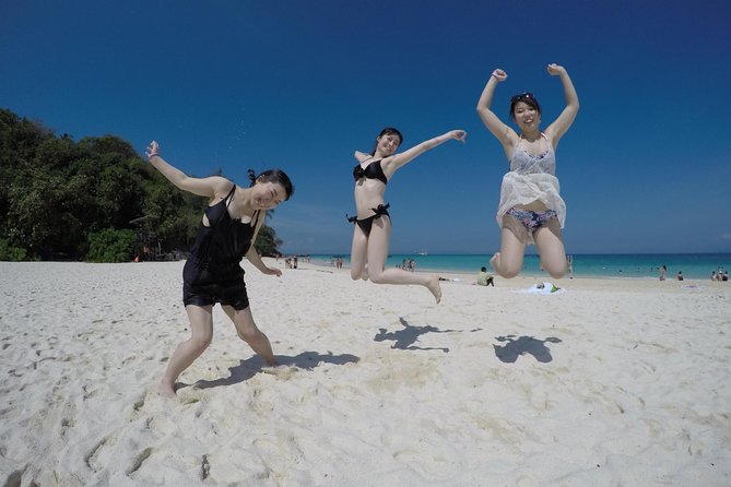 Phi Phi Islands Day Tour Bamboo and Maya Bay with Lunch By Speedboat - Bamboo Island: greenery, clear water, and that last-hour paradise feeling