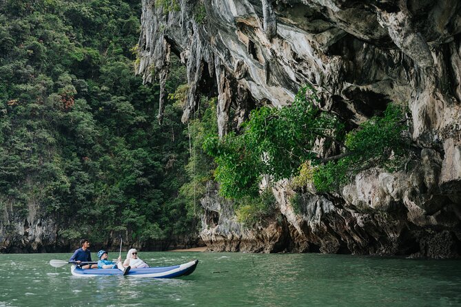 Phuket Sunset Big Boat Trip To Phang Nga Bay & James Bond Island - Canoeing through sea caves and secret lagoons: the work is shared